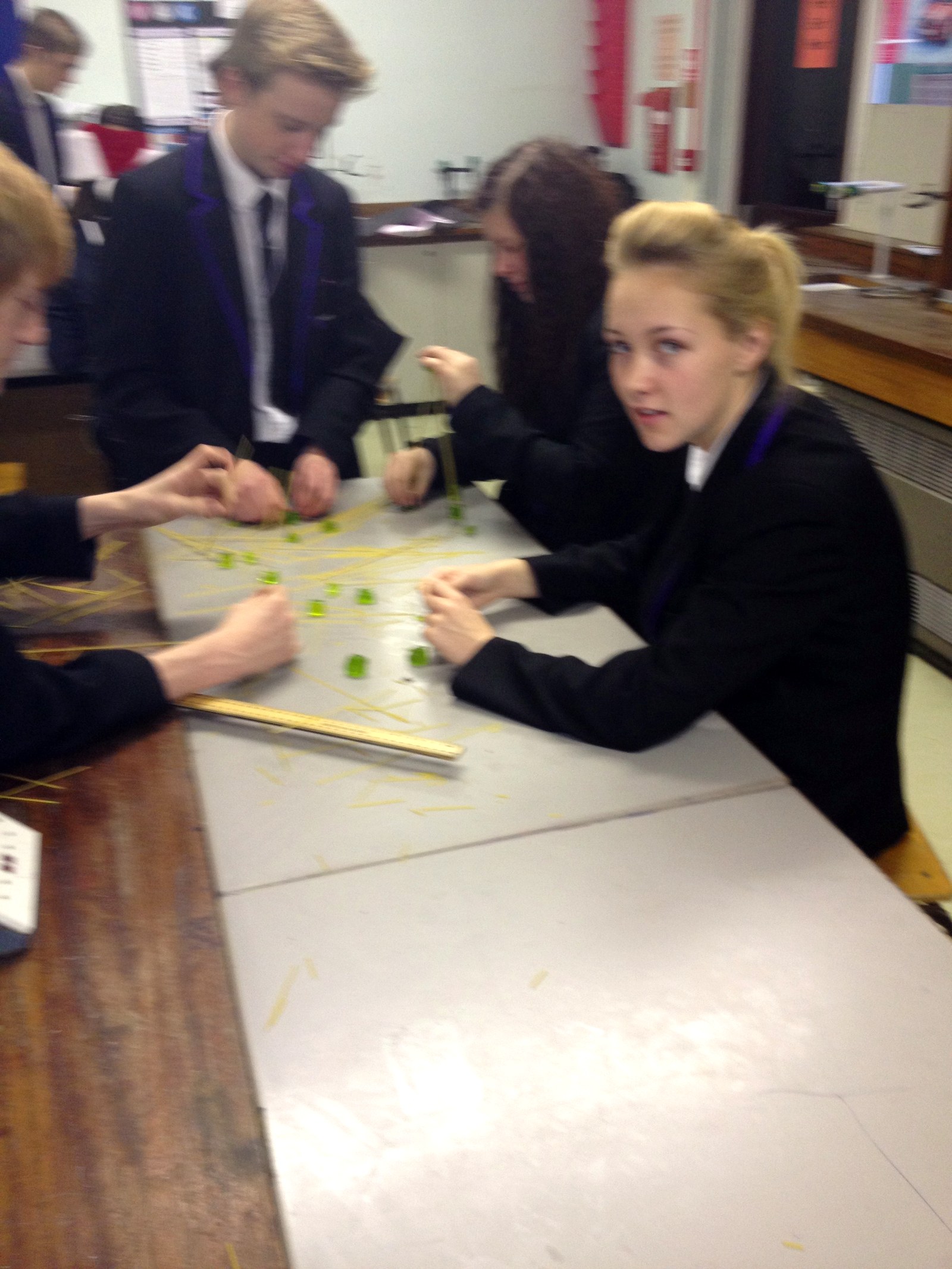 Students collaborating on a rate of reaction experiment