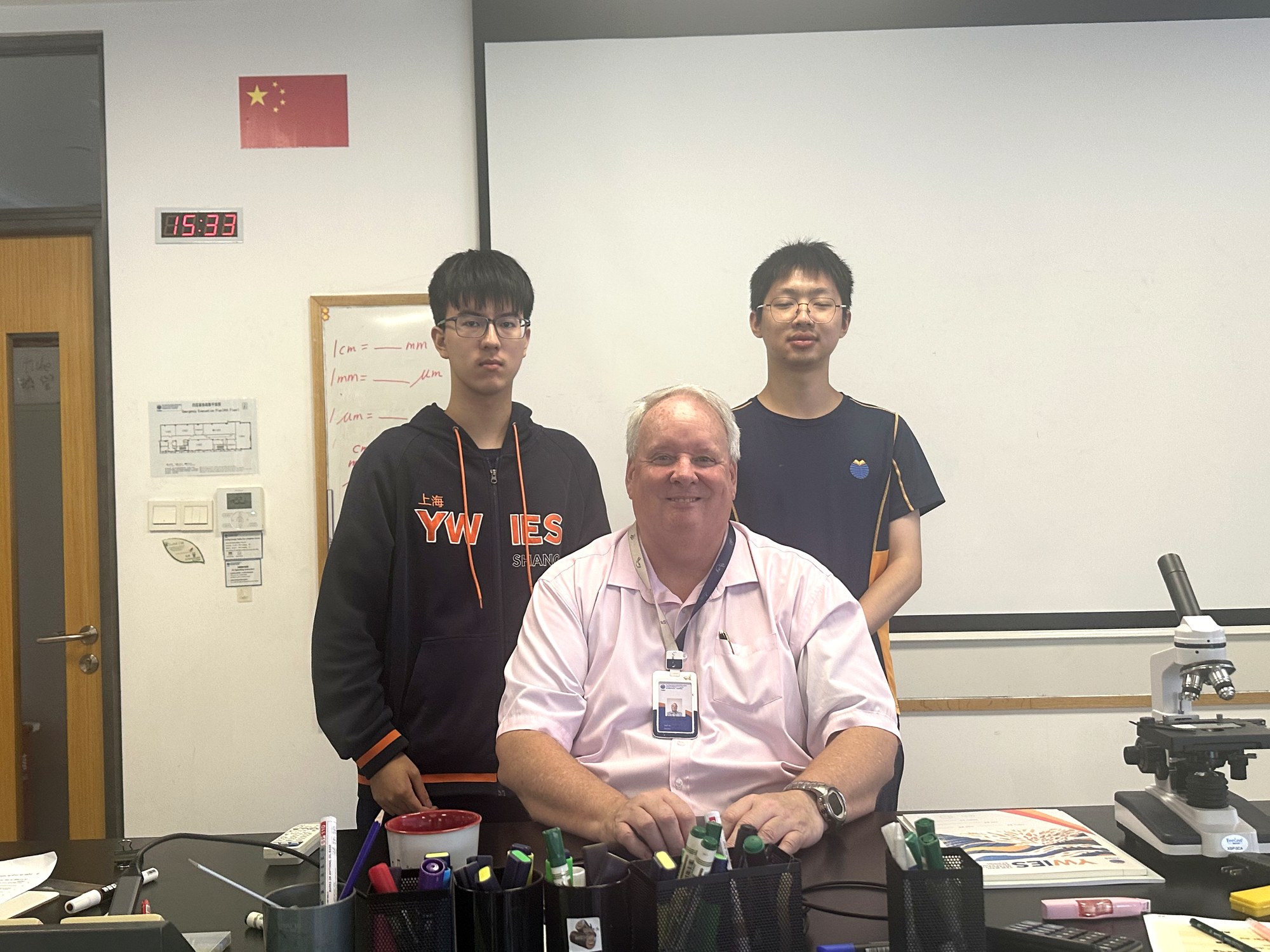 Andrew Greaves with senior students in a British international school chemistry classroom