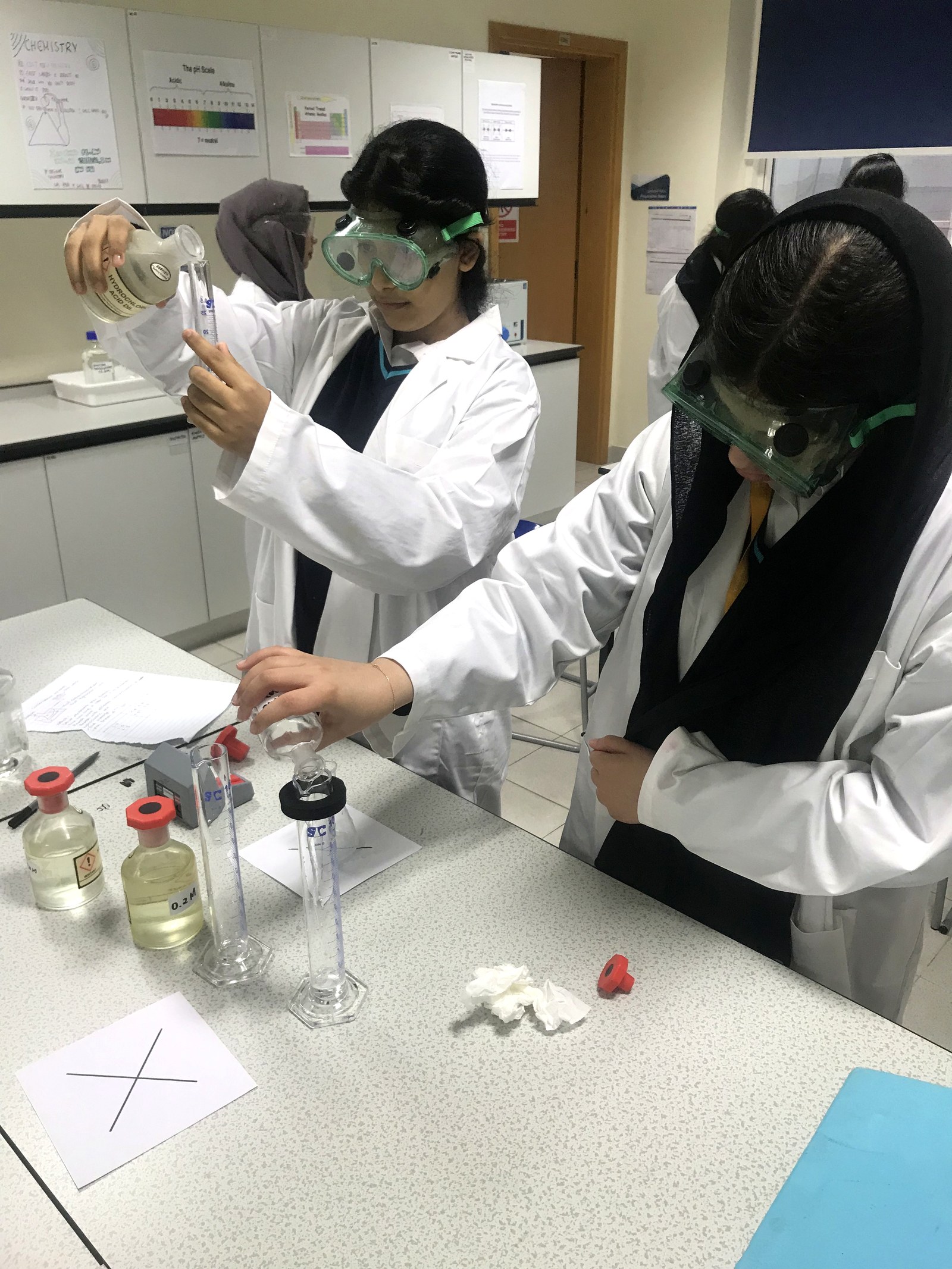 A student conducts a chemistry experiment during a lesson at a British international school in China